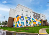 Thumbnail 48 of 58 - A large mural on the side of a building.