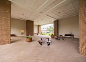 Thumbnail 53 of 58 - A large open space with benches and a planter.