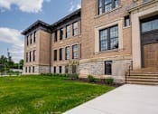 Thumbnail 23 of 58 - A large brick building with the words "Starling Ave" on the top.