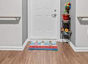 Thumbnail 29 of 33 - a hallway with a white door and rails