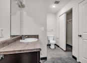 Thumbnail 27 of 51 - a bathroom with a sink and a toilet