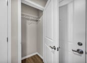 Thumbnail 22 of 51 - a closet in a bedroom with a door open to it