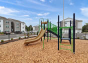 Thumbnail 24 of 50 - a playground with a slide and monkey bars