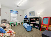 Thumbnail 21 of 66 - A child's playroom with a variety of toys and furniture.
