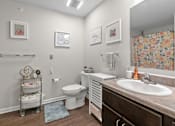 Thumbnail 15 of 33 - a bathroom with a toilet sink and mirror