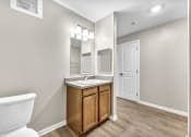 Thumbnail 15 of 51 - an empty bathroom with a toilet and a sink
