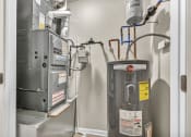 Thumbnail 26 of 51 - an image of a heating system in a room with a boiler and a gas furnace