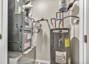 Thumbnail 14 of 51 - an image of a heating system in a room with a boiler and a gas furnace