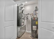 Thumbnail 16 of 51 - a room with a heating and cooling system and a door