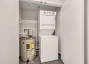 Thumbnail 25 of 51 - a small laundry room with a washer and dryer