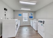 Thumbnail 20 of 50 - laundry room with washers and dryers at the preserve at great pond apartments in windsor