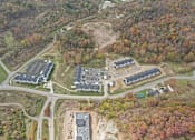 Thumbnail 19 of 56 - an aerial view of several buildings and a road