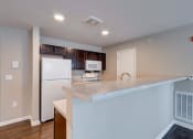 Thumbnail 9 of 32 - a kitchen with a large island and white appliances