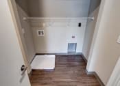 Thumbnail 30 of 32 - a bedroom with a medium sized closet and hardwood floors