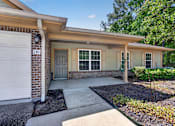 Thumbnail 38 of 48 - A house with a garage door numbered 180 is shown.