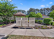 Thumbnail 41 of 48 - A gazebo sits in front of a row of mailboxes on a sunny day.