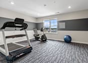 Thumbnail 16 of 33 - the retreat at thousand oaks fitness room with treadmill and exercise balls