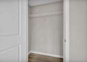 Thumbnail 46 of 51 - the closet in a bedroom with white walls and a white