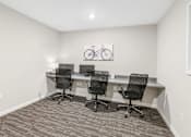 Thumbnail 14 of 33 - a room with three desks and three chairs