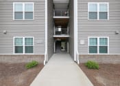 Thumbnail 37 of 50 - a walkway leading to an apartment building