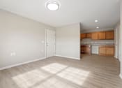 Thumbnail 19 of 76 - an empty living room and kitchen in a new home
