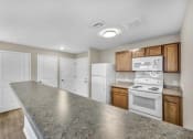 Thumbnail 9 of 51 - a kitchen with white appliances and a counter top