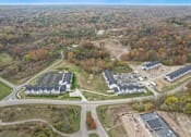 Thumbnail 30 of 78 - an aerial view of several buildings and a road