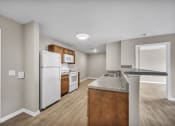 Thumbnail 45 of 51 - a kitchen with a counter top and a refrigerator