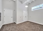 Thumbnail 29 of 51 - a bedroom with grey carpet and white walls