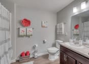 Thumbnail 47 of 50 - a bathroom with a toilet sink and mirror