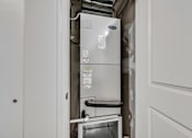 Thumbnail 32 of 51 - a white refrigerator freezer sitting next to a doorway