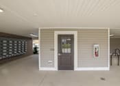 Thumbnail 2 of 84 - the front door of a home with a porch