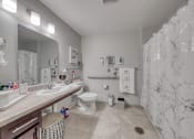 Thumbnail 43 of 50 - a bathroom with a sink toilet and shower