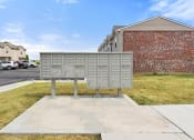 Thumbnail 31 of 37 - the mailbox is on the sidewalk in front of a building
