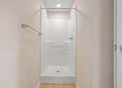 Thumbnail 16 of 76 - a white bathroom with a shower and a shower curtain