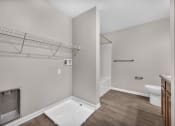 Thumbnail 50 of 51 - a bathroom with a shower and a toilet and a closet