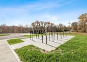 Thumbnail 32 of 76 - a row of handrails in a park