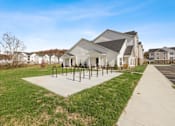 Thumbnail 30 of 76 - a house with a sidewalk and bike racks in front of it