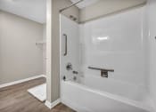 Thumbnail 51 of 51 - a white bathroom with a shower and a tub