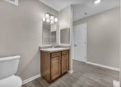 Thumbnail 48 of 51 - an empty bathroom with a toilet and a sink