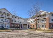 Thumbnail 28 of 33 - Apartment complex with a mix of brick and siding exteriors.
