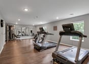 Thumbnail 31 of 45 - the gym in the home has treadmills and other exercise equipment