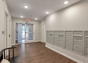 Thumbnail 28 of 45 - the laundry room has plenty of cabinets and drawers and a door to the hallway