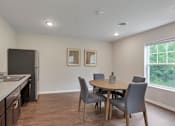 Thumbnail 33 of 45 - a kitchen and dining room with a table and chairs