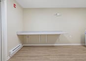Thumbnail 41 of 78 - an empty room with a counter and a refrigerator