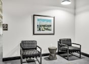 Thumbnail 17 of 51 - a seating area with two chairs and a coffee table
