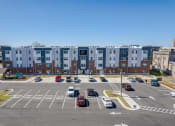 Thumbnail 2 of 35 - an aerial view of an empty parking lot in front of an apartment building