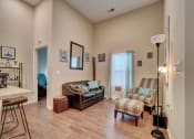Thumbnail 18 of 25 - a living room with a couch and two chairs