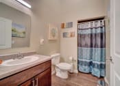Thumbnail 8 of 25 - a bathroom with a toilet sink and shower
