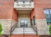 Thumbnail 25 of 25 - a brick building with a sign that says holly pointe